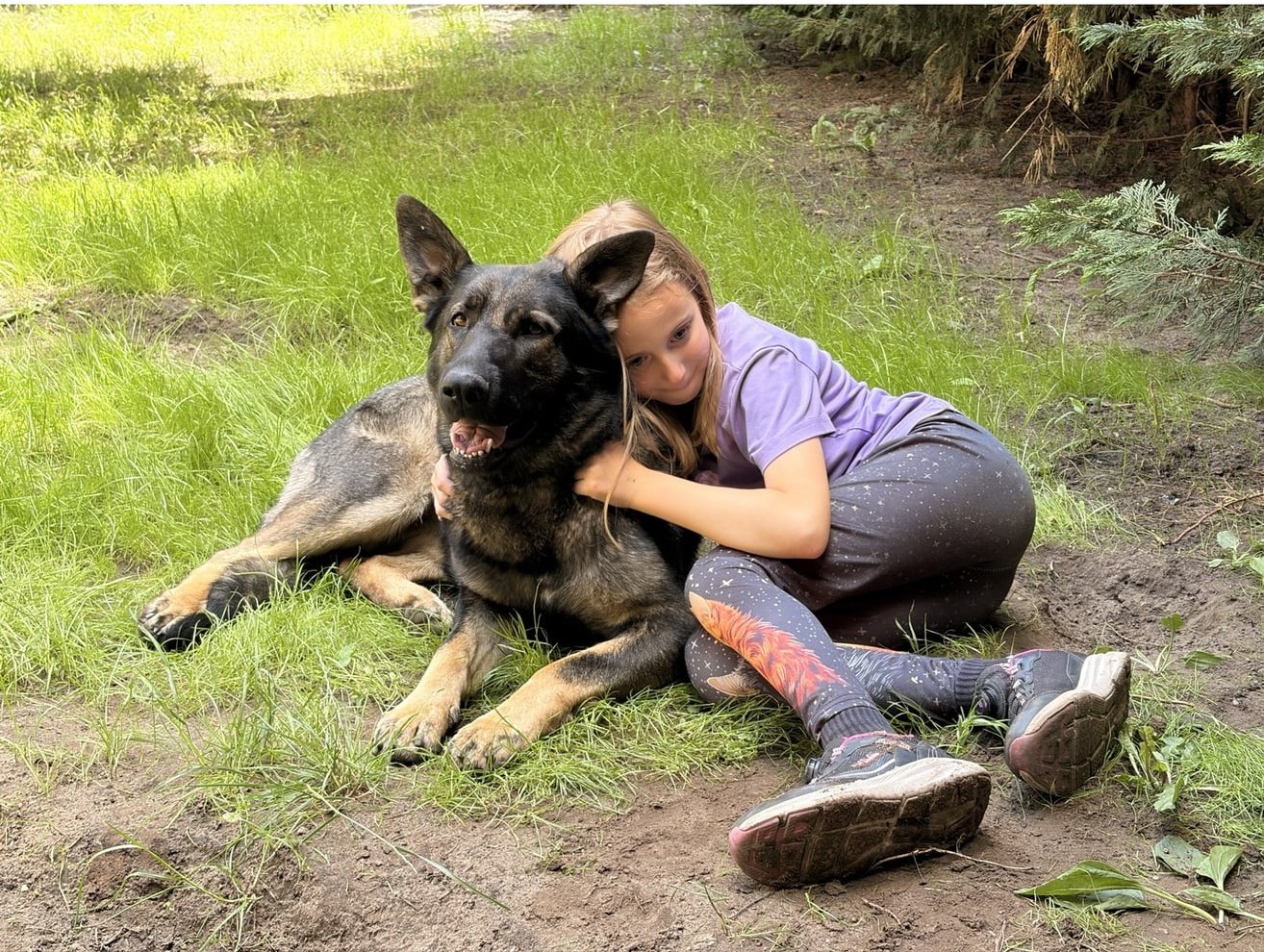Sunny relaxing with her young family member